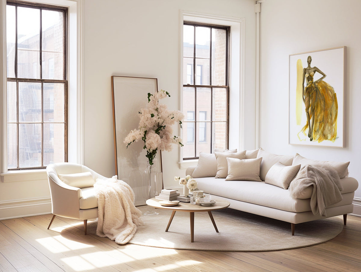 a living room with a couch, chair, coffee table and a vase of flowers